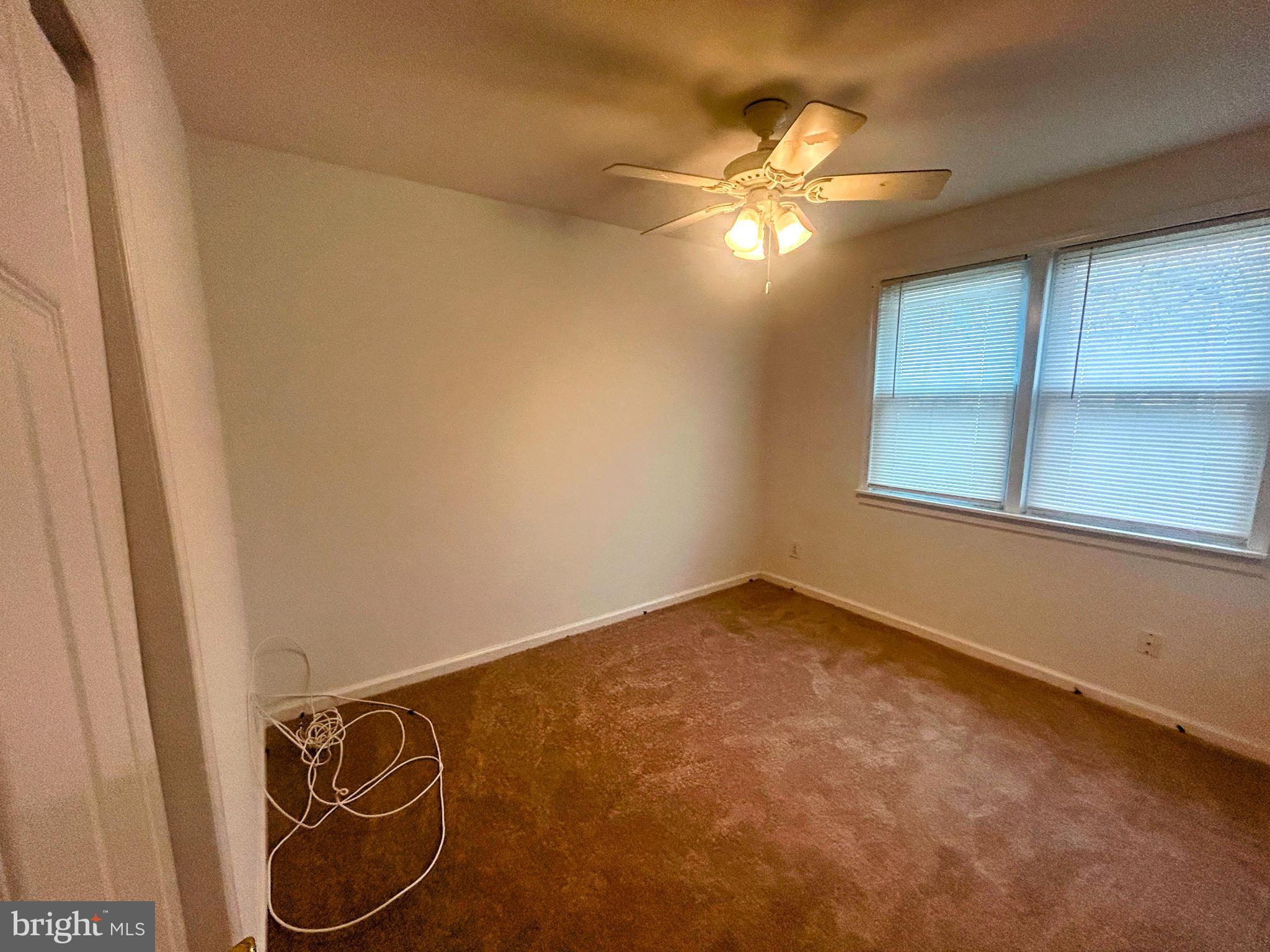 787 Pennsylvania Avenue Wallingford, PA 19086 - Photo 25 of 26 a view of a room with chandelier fan and a window