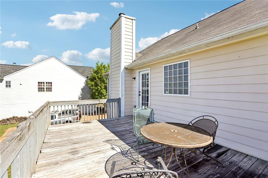 9720 Poole Road Villa Rica, GA 30180 - Photo 36 of 40 a backyard of a house with table and chairs