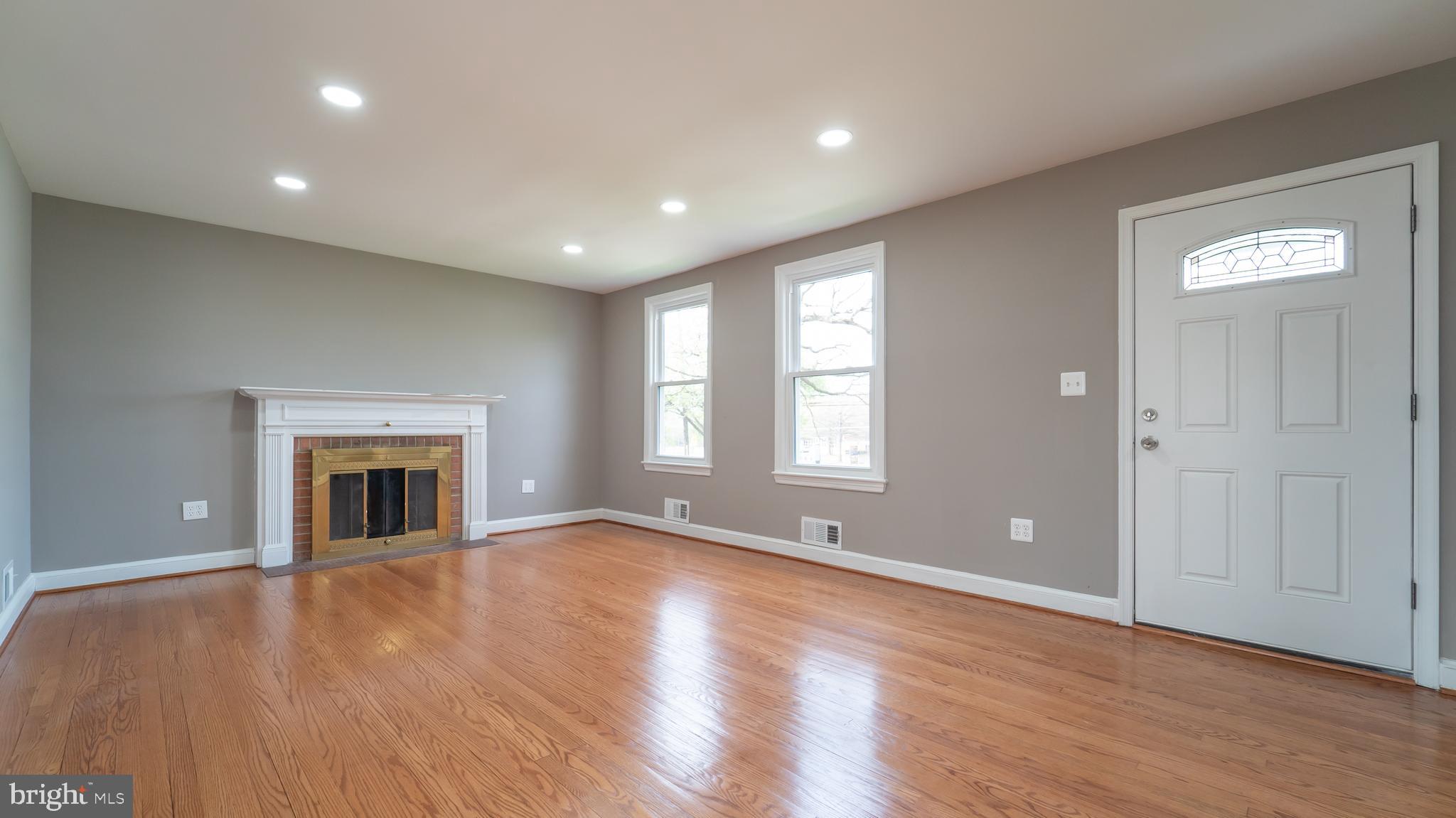 7005 Adelphi Road University Park, MD 20782 - Photo 10 of 39 Living Room with Wood Burning Fireplace
