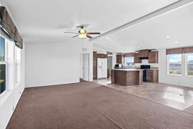 a view of a kitchen with a sink and a window