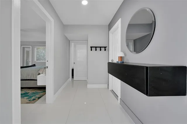 a kitchen with a sink and a mirror