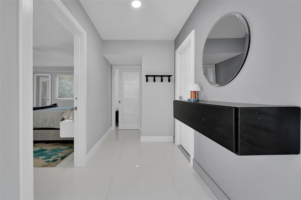 640 Northwest 30th Street Wilton Manors, FL 33311 - Photo 14 of 25 a kitchen with a sink and a mirror