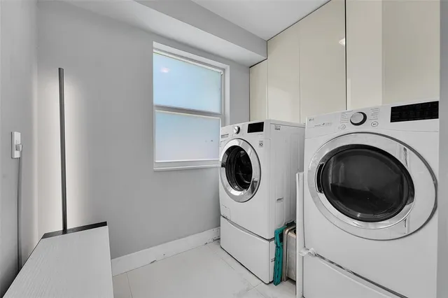 a utility room with dryer and washer