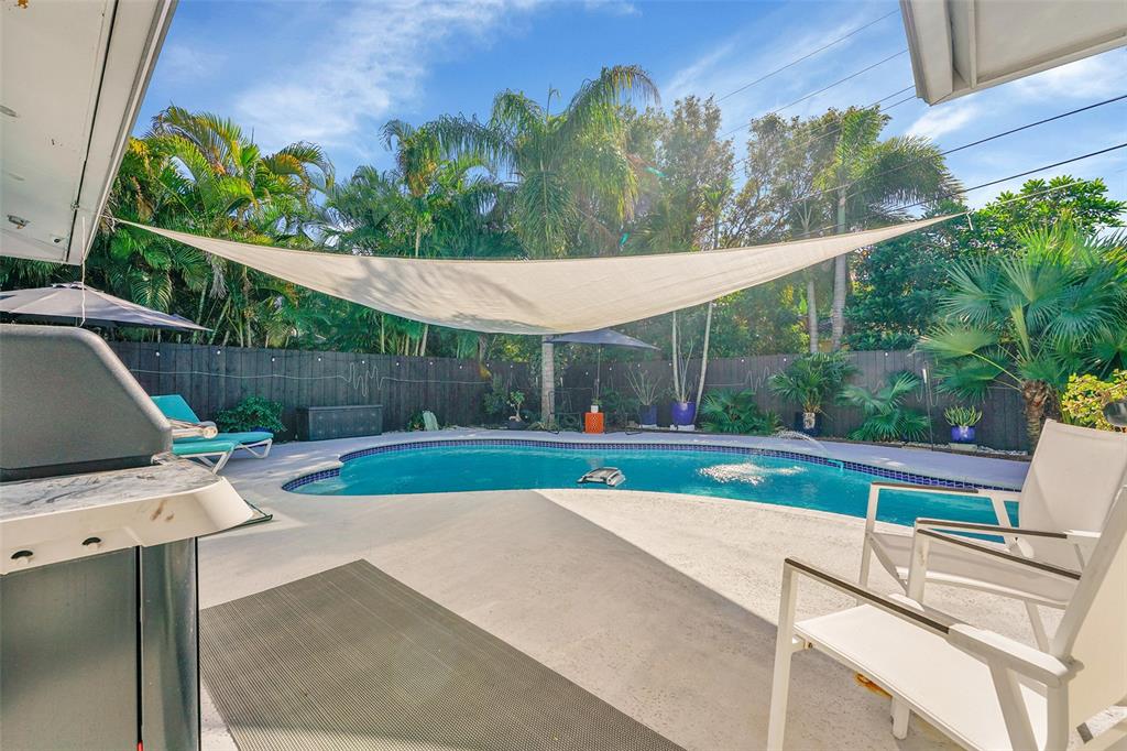 640 Northwest 30th Street Wilton Manors, FL 33311 - Photo 21 of 25 a view of a backyard with sitting area
