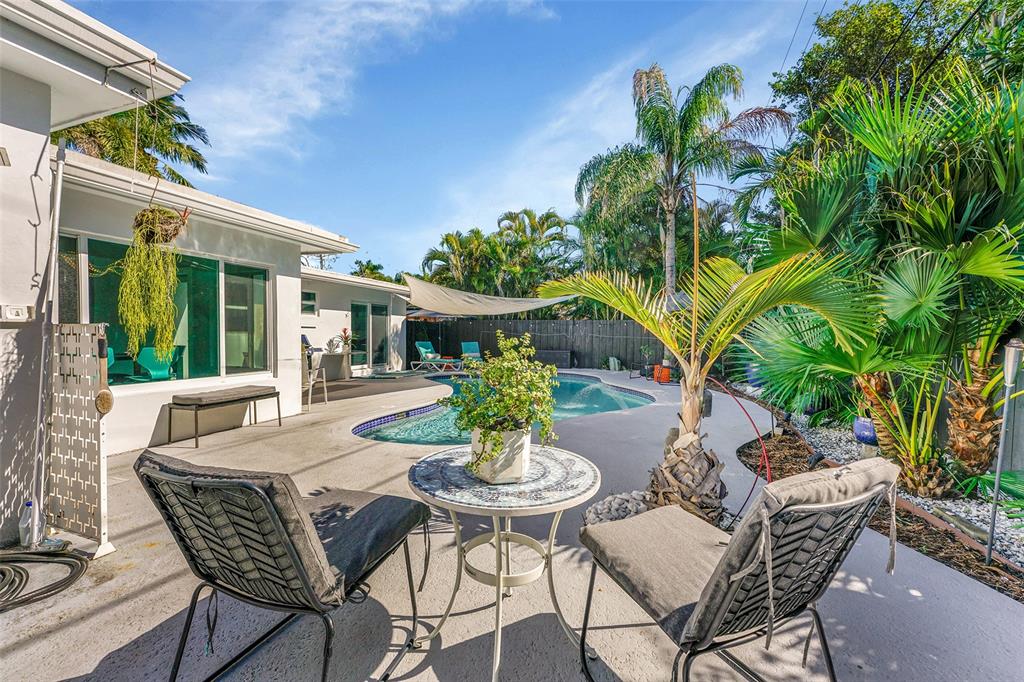 640 Northwest 30th Street Wilton Manors, FL 33311 - Photo 23 of 25 a view of a patio with a table and chairs