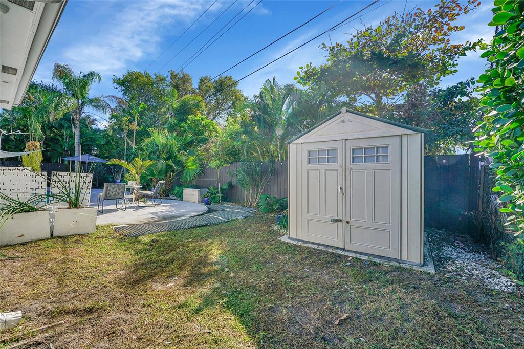 640 Northwest 30th Street Wilton Manors, FL 33311 - Photo 24 of 25 a view of a house with backyard and sitting area