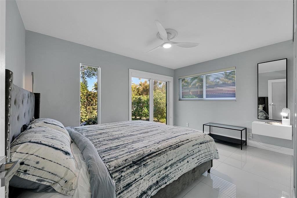 640 Northwest 30th Street Wilton Manors, FL 33311 - Photo 5 of 25 a bedroom with a bed and a window