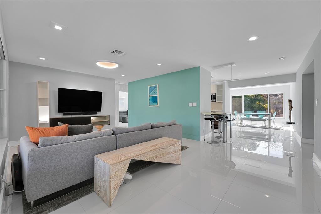 640 Northwest 30th Street Wilton Manors, FL 33311 - Photo 8 of 25 a living room with furniture and a flat screen tv