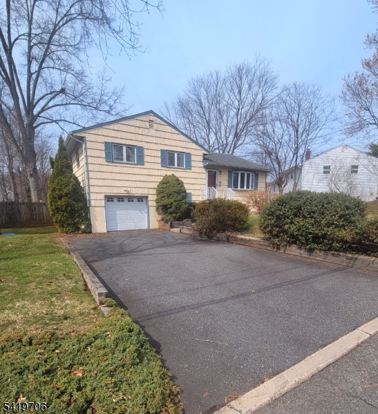 117 Tillotson Road Fanwood, NJ 07023 - Photo 1 of 30 a front view of a house with a yard and garage