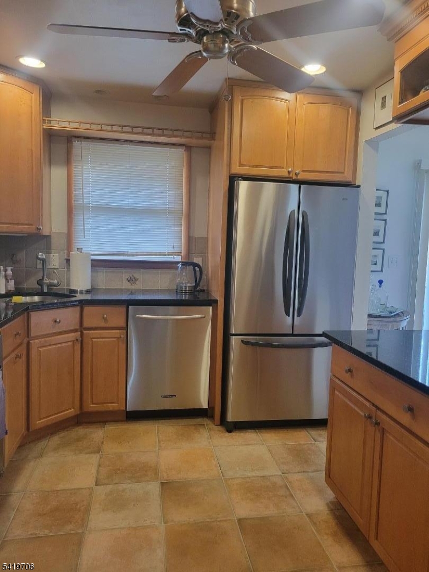 117 Tillotson Road Fanwood, NJ 07023 - Photo 11 of 30 a kitchen with stainless steel appliances granite countertop a refrigerator a sink and a stove