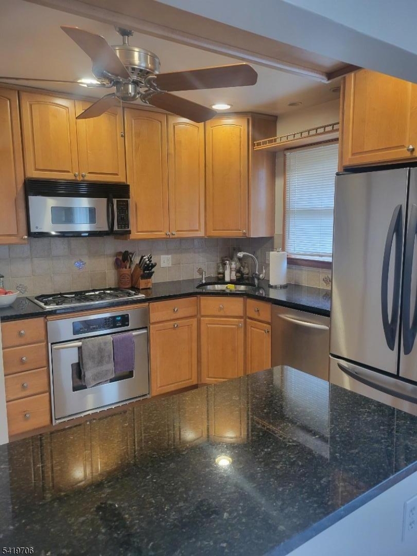 117 Tillotson Road Fanwood, NJ 07023 - Photo 12 of 30 a kitchen with granite countertop a sink cabinets and stainless steel appliances