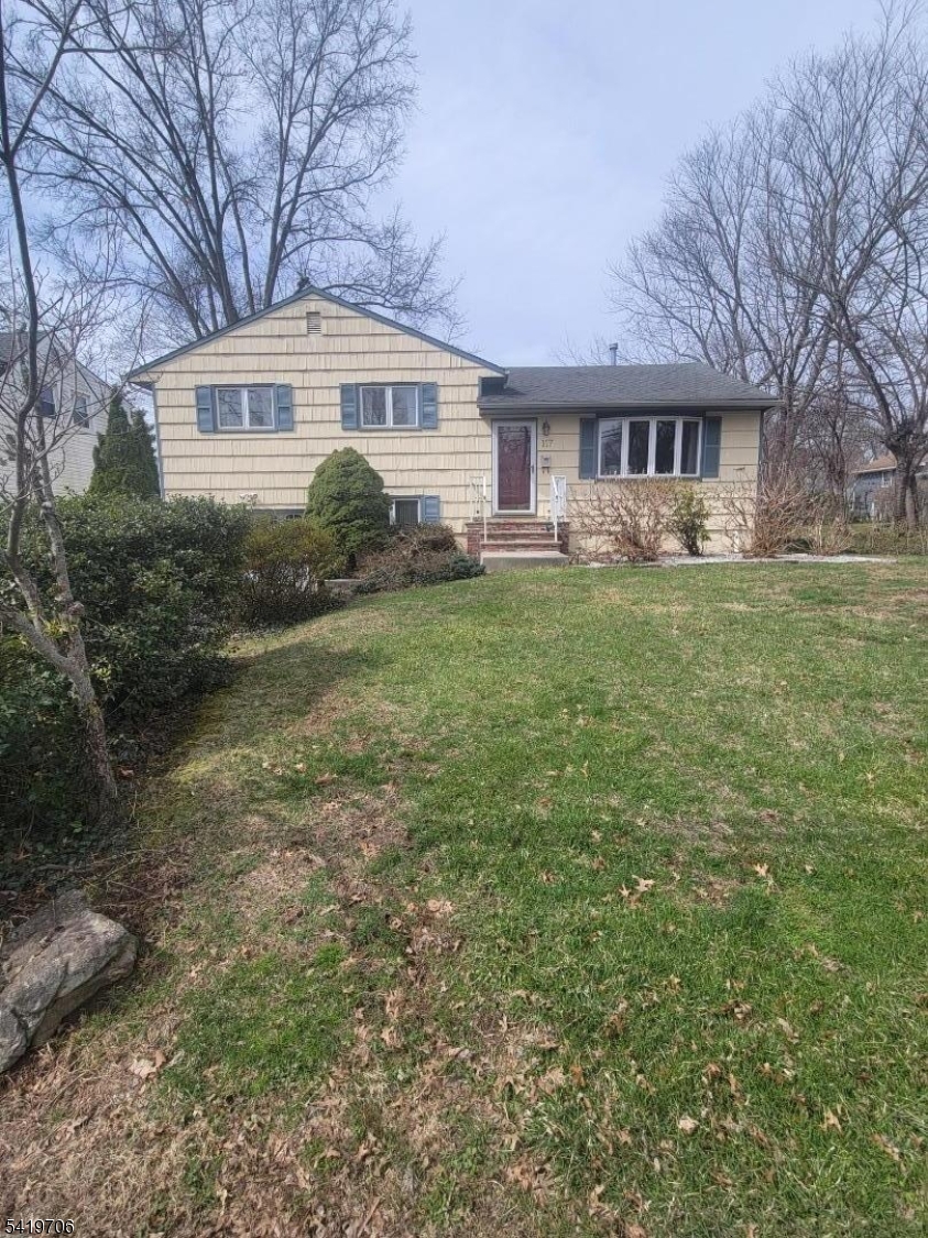 117 Tillotson Road Fanwood, NJ 07023 - Photo 2 of 30 a front view of a house with a garden