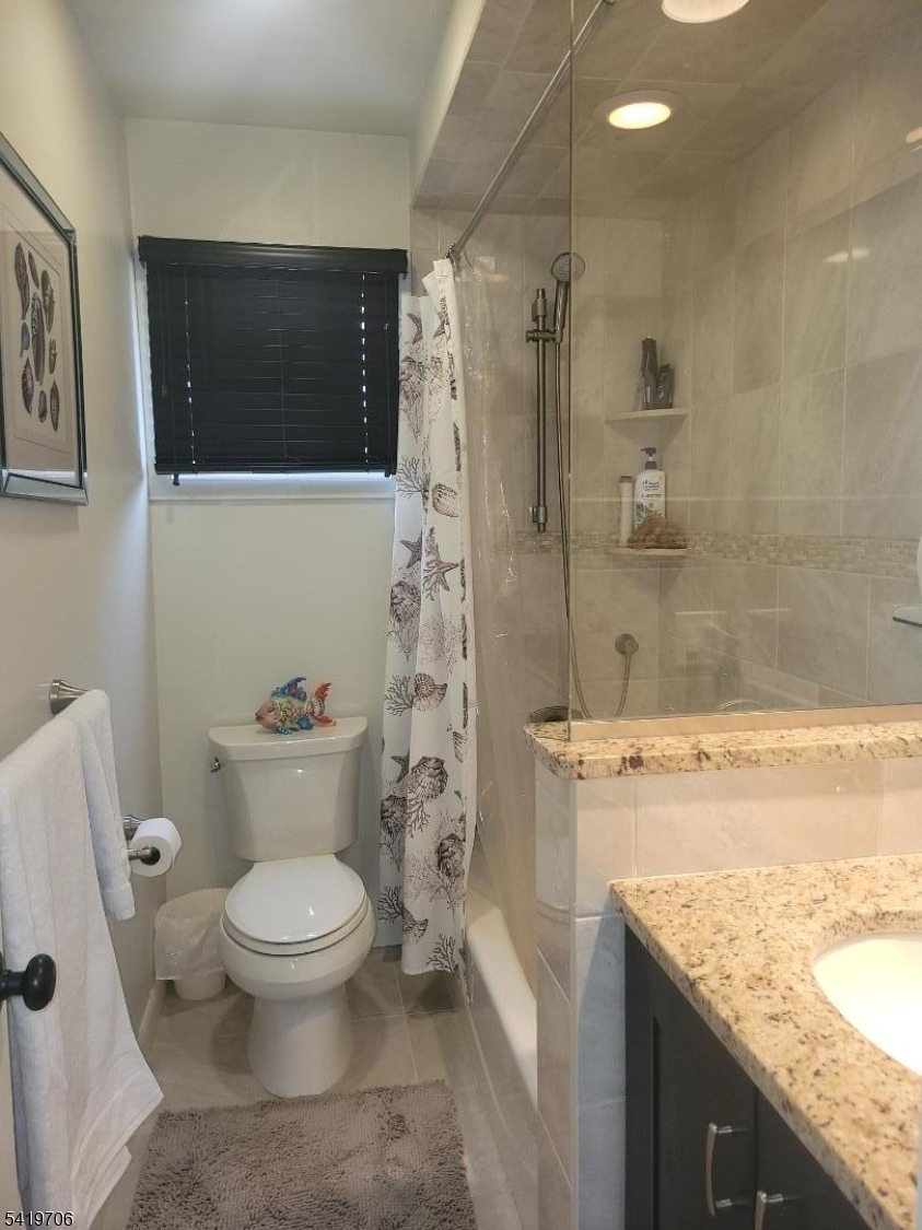 117 Tillotson Road Fanwood, NJ 07023 - Photo 25 of 30 a white toilet sitting next to a bathroom sink