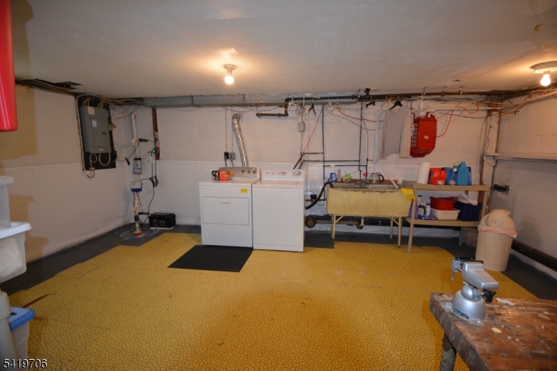 117 Tillotson Road Fanwood, NJ 07023 - Photo 26 of 30 a room with furniture and a flat screen tv