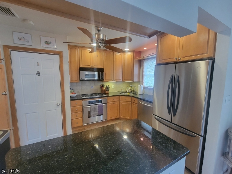117 Tillotson Road Fanwood, NJ 07023 - Photo 8 of 30 a kitchen with granite countertop a refrigerator and a sink