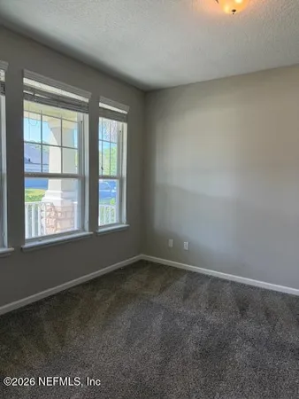 a kitchen with stainless steel appliances granite countertop a stove a sink dishwasher and a refrigerator with wooden cabinets