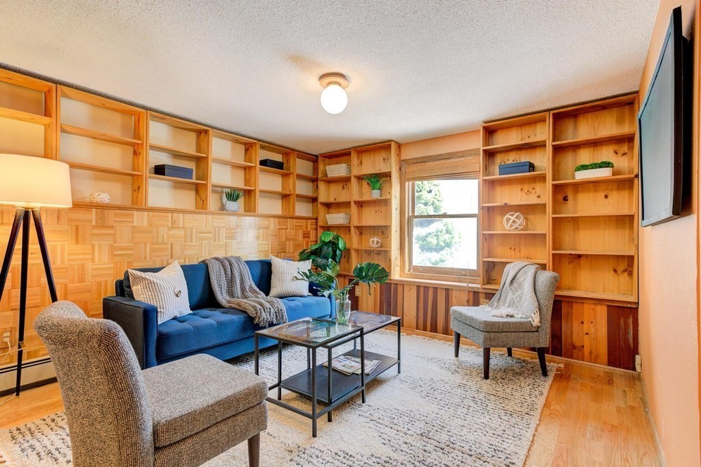 68 Dothan Street Arlington, MA 02474 - Photo 18 of 42 a living room with furniture and a window