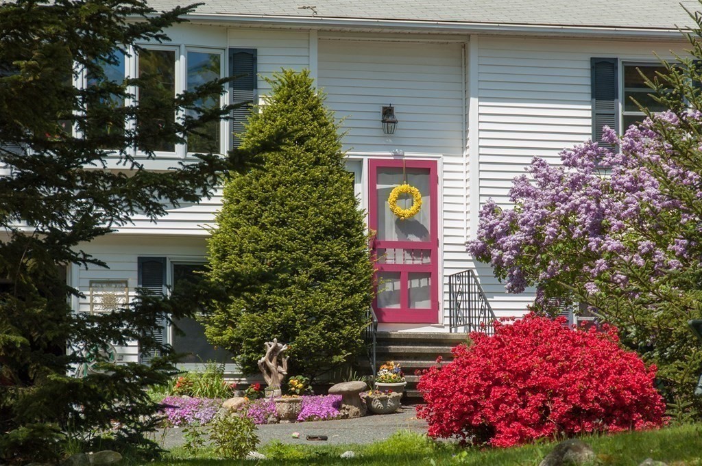68 Dothan Street Arlington, MA 02474 - Photo 2 of 42 a front view of a house with a yard and garage