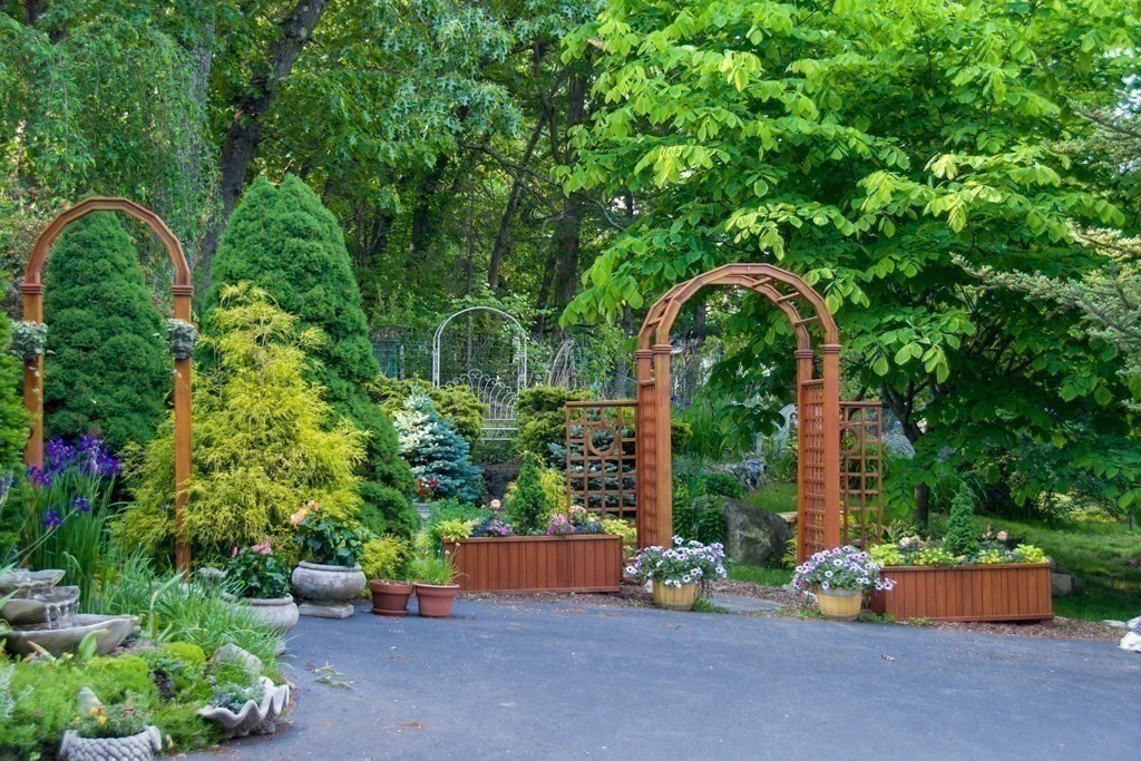 68 Dothan Street Arlington, MA 02474 - Photo 35 of 42 a backyard of a house with outdoor seating and green space