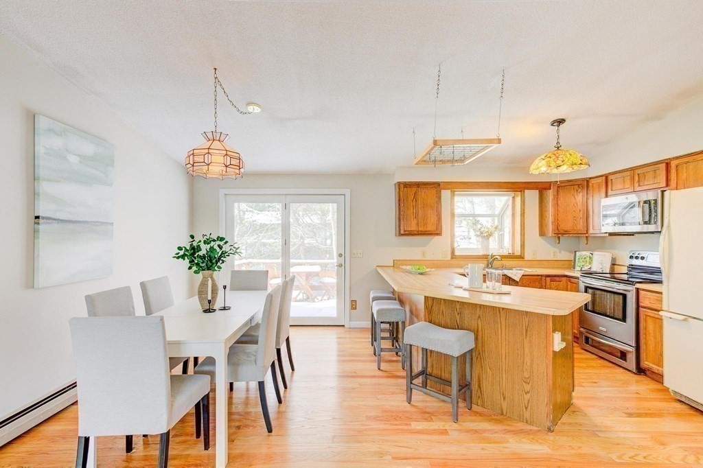 68 Dothan Street Arlington, MA 02474 - Photo 8 of 42 a view of a dining room with furniture and wooden floor