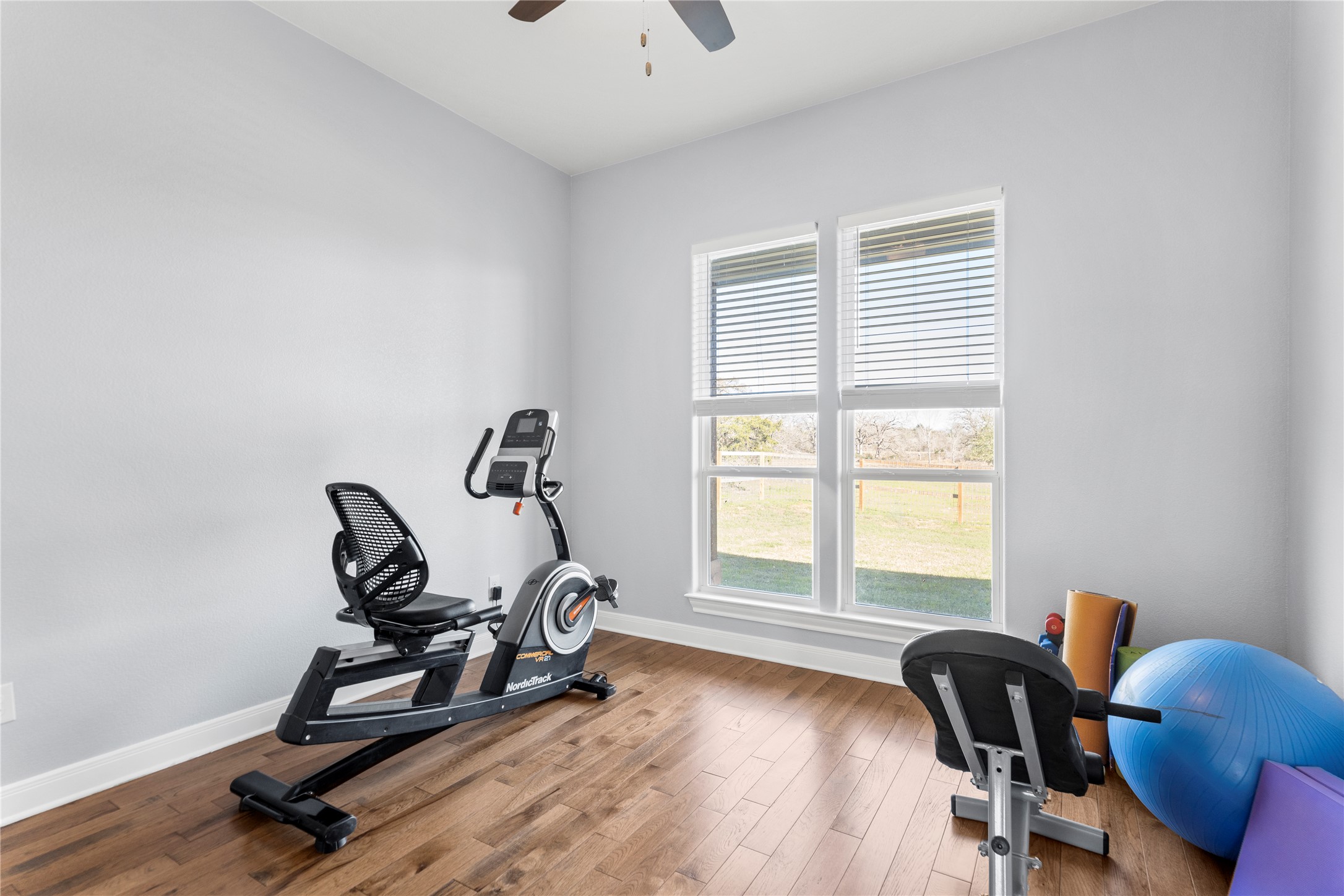 1434 Antioch Road Paige, TX 78659 - Photo 24 of 40 Used as a Workout area featuring wood-style floors and a ceiling fan or Bedroom #2