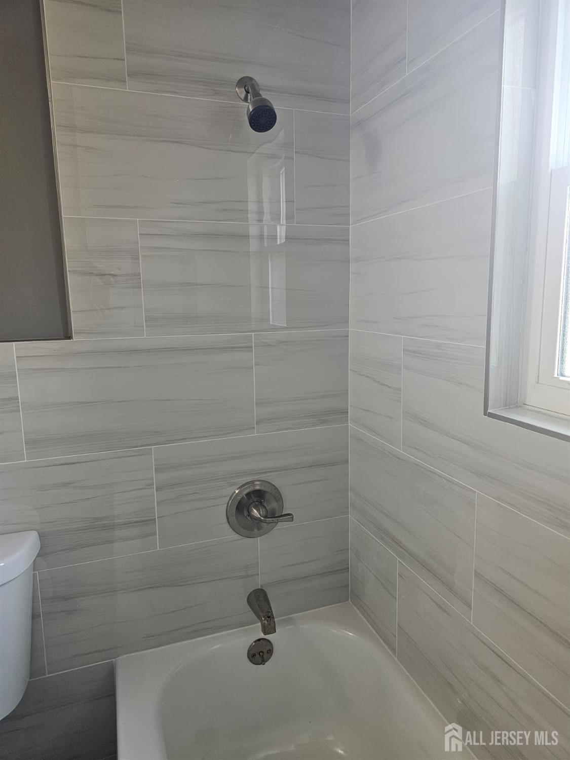 57 Judson Street, Unit 9A Edison, NJ 08837 - Photo 11 of 13 a bathroom with a shower