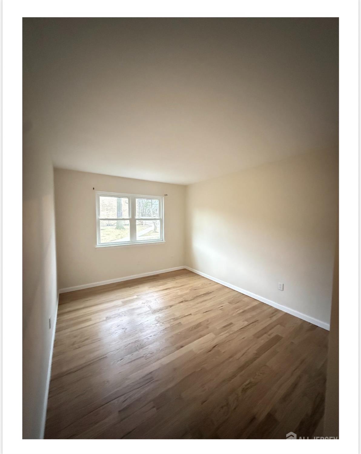 57 Judson Street, Unit 9A Edison, NJ 08837 - Photo 6 of 7 a view of an empty room and window