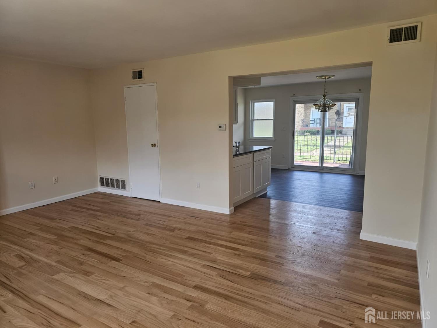 57 Judson Street, Unit 9A Edison, NJ 08837 - Photo 9 of 13 a view of empty room with wooden floor and fan