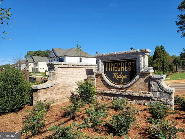 a sign board with a lake view