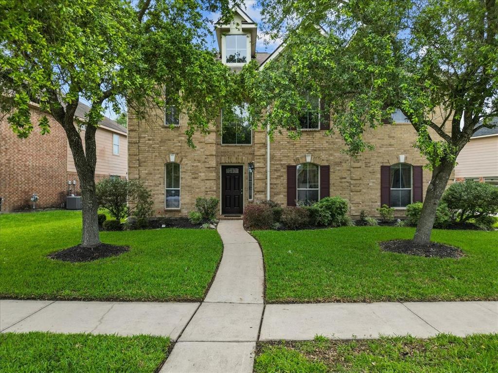 Great curb appeal with two mature trees