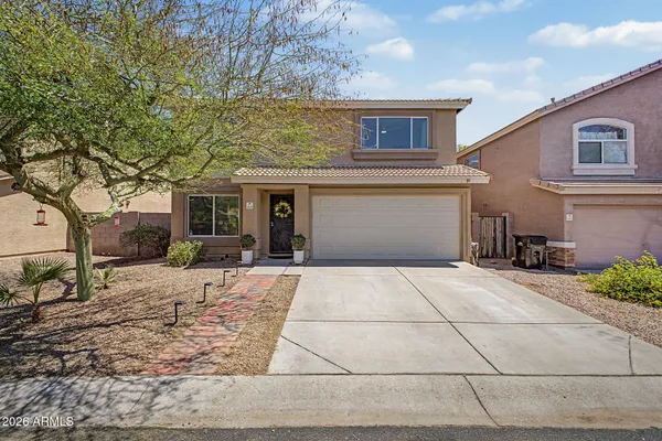 a front view of a house with yard