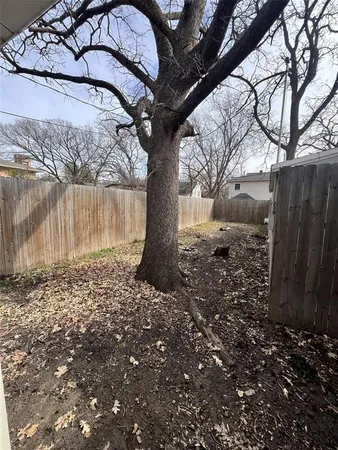 a view of a backyard of the house