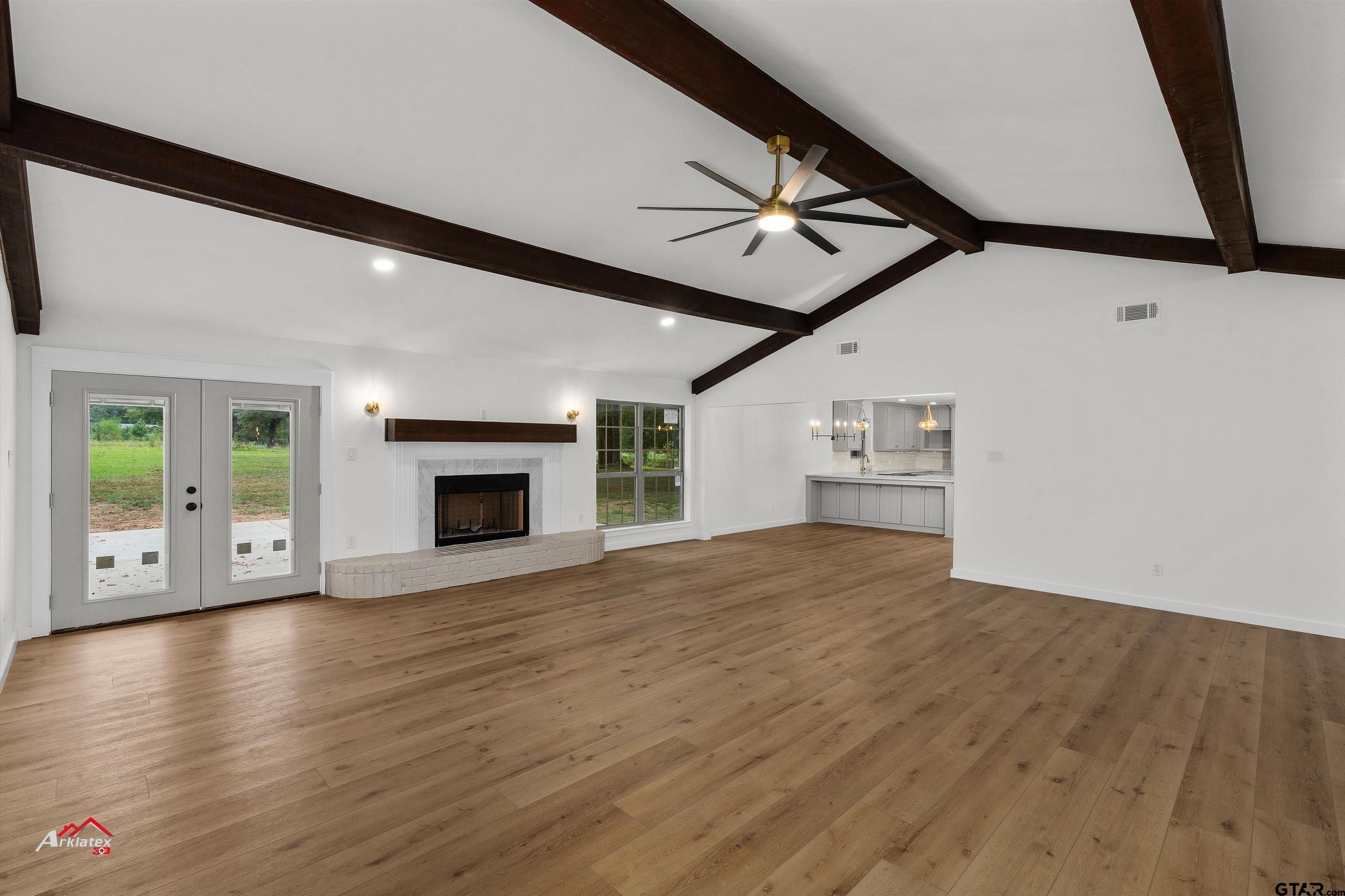 875 Old Town Road Marshall, TX 75672 - Photo 11 of 34 a view of an empty room with window and wooden floor