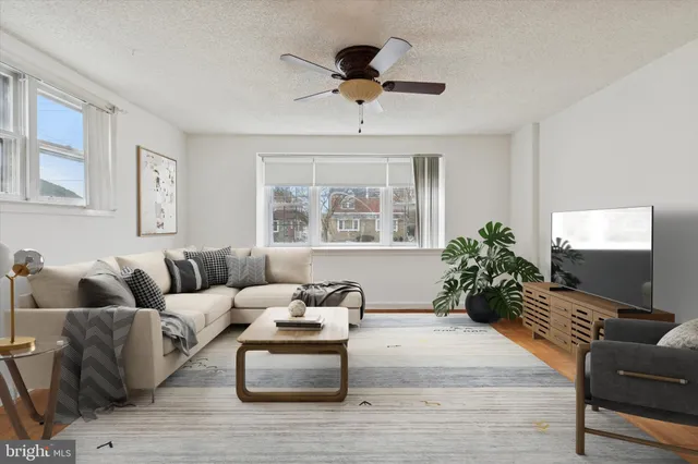 a living room with furniture and a large window