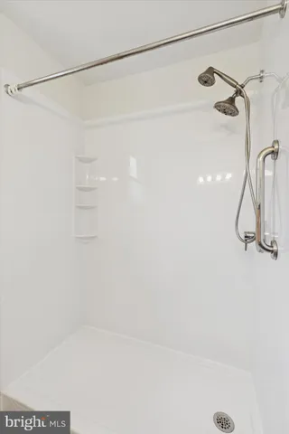 a bathroom with a sink toilet and mirror