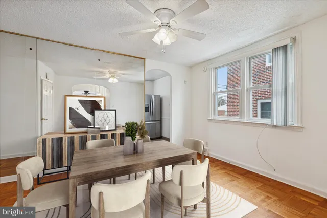 a view of a dining room with furniture and wooden floor