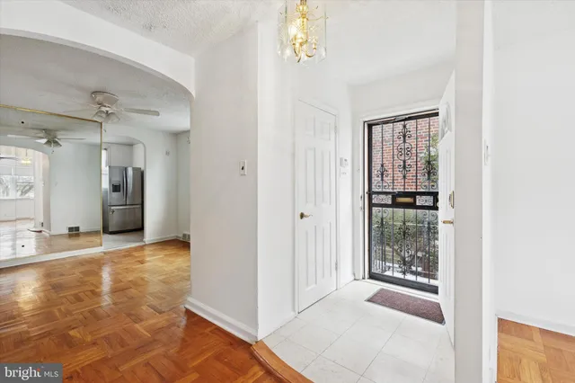 a kitchen with stainless steel appliances a refrigerator stove and microwave