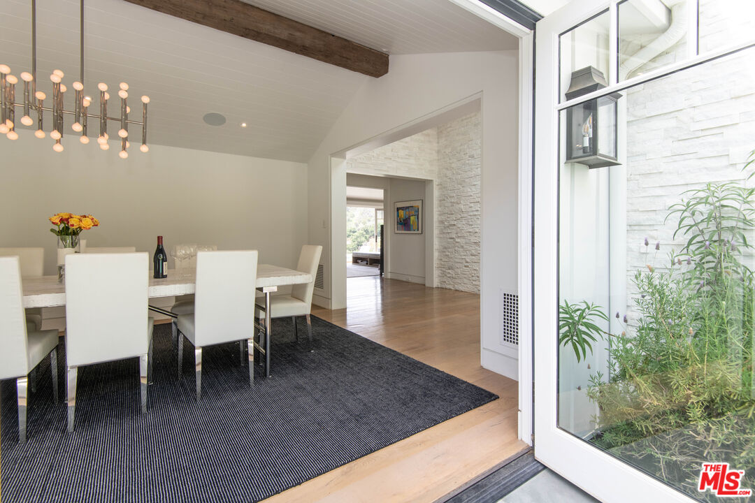 13705 Romany Drive Pacific Palisades, CA 90272 - Photo 13 of 54 a dining room with furniture and window