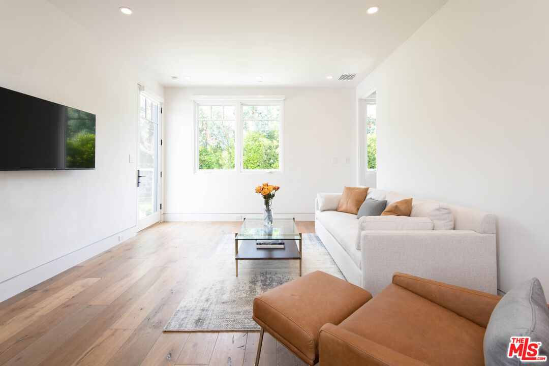 13705 Romany Drive Pacific Palisades, CA 90272 - Photo 44 of 54 a living room with furniture a flat screen tv and a window