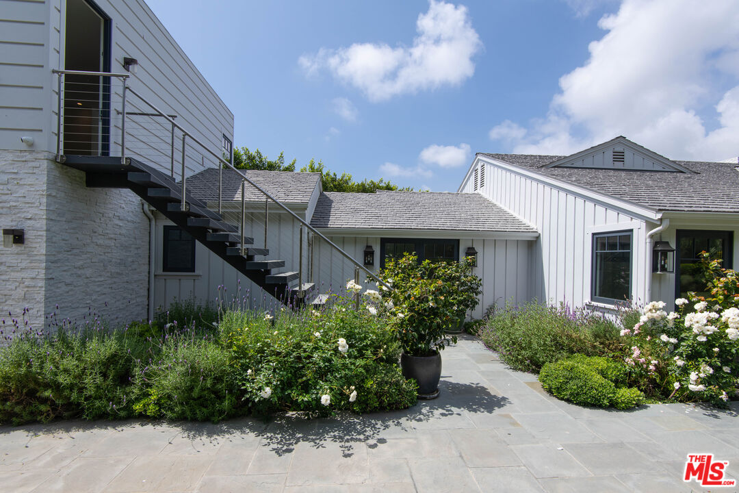 13705 Romany Drive Pacific Palisades, CA 90272 - Photo 50 of 54 a front view of a house with a garden