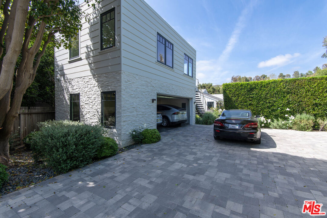 13705 Romany Drive Pacific Palisades, CA 90272 - Photo 52 of 54 a car parked in front of a house