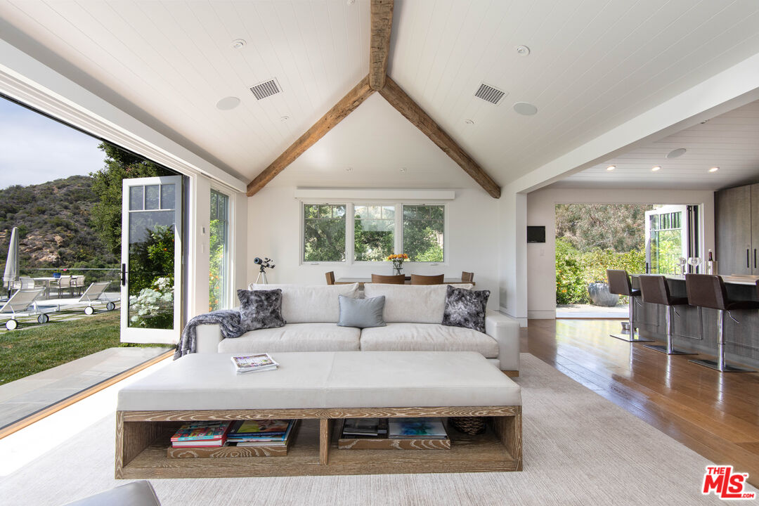13705 Romany Drive Pacific Palisades, CA 90272 - Photo 6 of 54 a living room with furniture and a large window