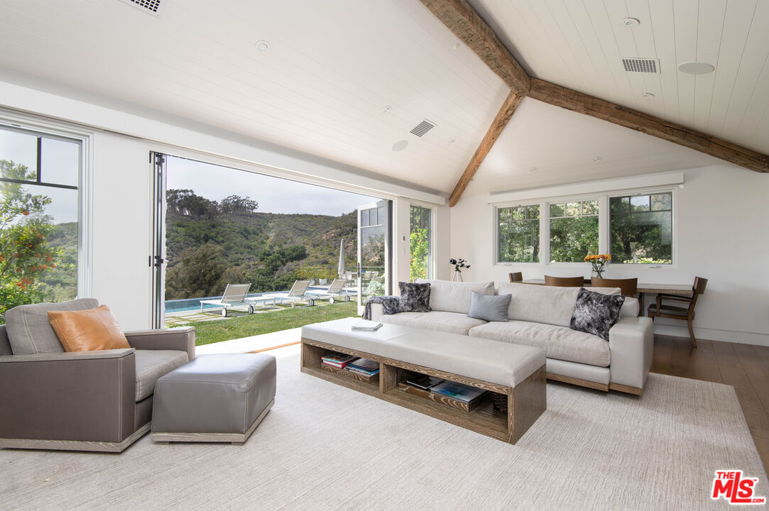 13705 Romany Drive Pacific Palisades, CA 90272 - Photo 7 of 54 a living room with furniture and a large window
