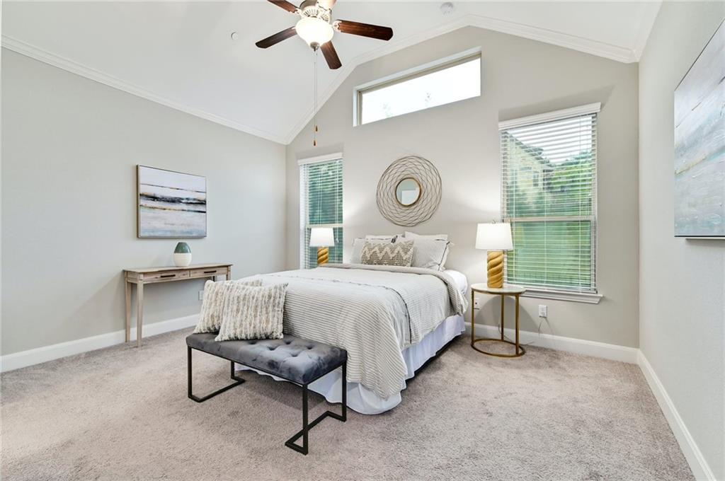 204 Maxwell Way, Unit 39 Austin, TX 78738 - Photo 12 of 26 a bedroom with a bed a chandelier and a window