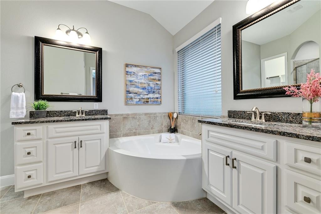 204 Maxwell Way, Unit 39 Austin, TX 78738 - Photo 13 of 26 a bathroom with a sink and a mirror