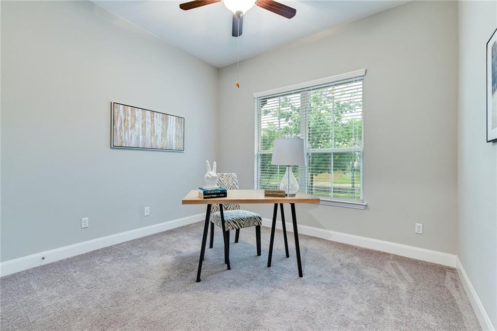 204 Maxwell Way, Unit 39 Austin, TX 78738 - Photo 21 of 26 a work room with furniture and a window