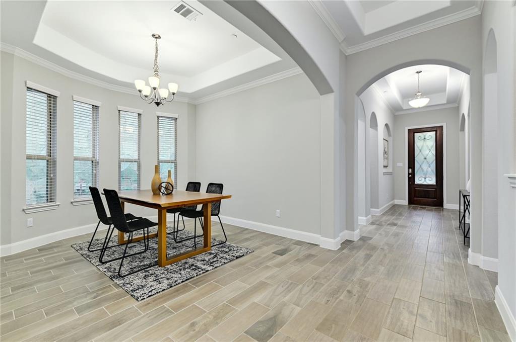 204 Maxwell Way, Unit 39 Austin, TX 78738 - Photo 4 of 26 a view of a dining room with furniture window and wooden floor
