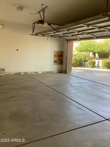 a view of a big room with air conditioner duct and materials on floor