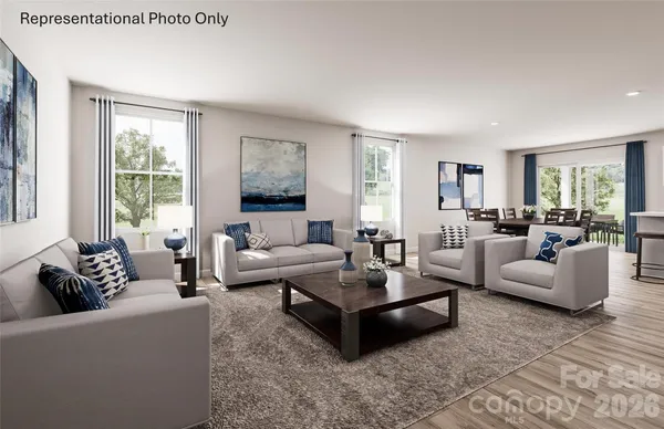 a living room with furniture and windows