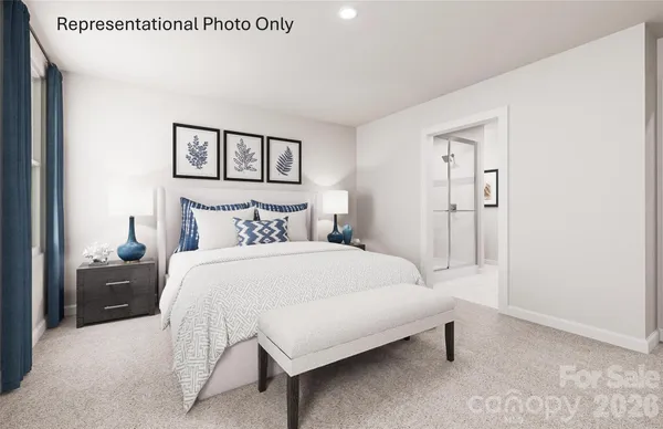 a bedroom with a bed and night stand